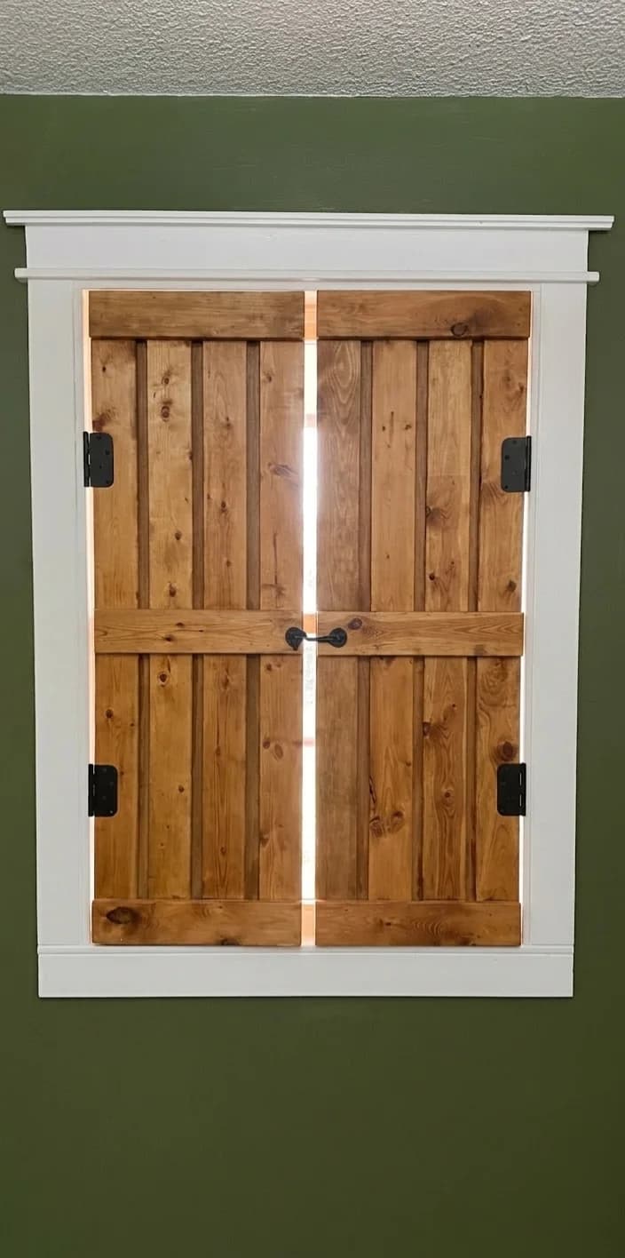 Custom interior wood shutters fitted to a residential window